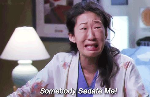 GIF of Cristina Yang sobbing "somebody sedate me"